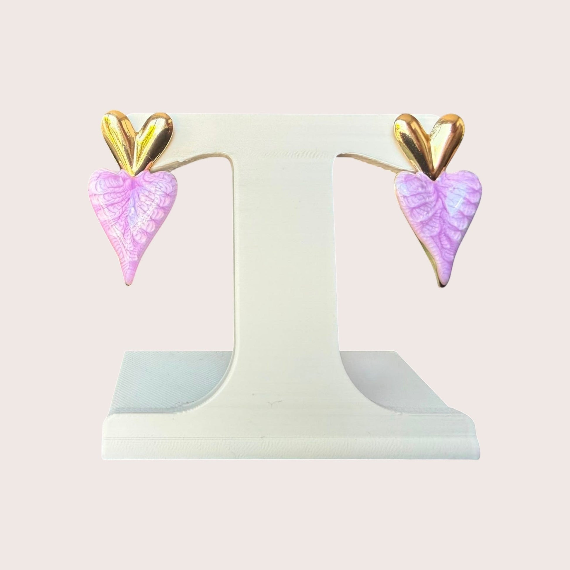 Nitelief Amour Rose dangling heart earrings featuring gold tops and textured light pink heart-shaped drops.