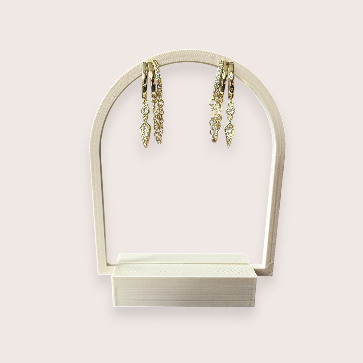 Nitelief gold hoop earrings featuring delicate dangling chains and sparkling crystal-encrusted geometric charms.