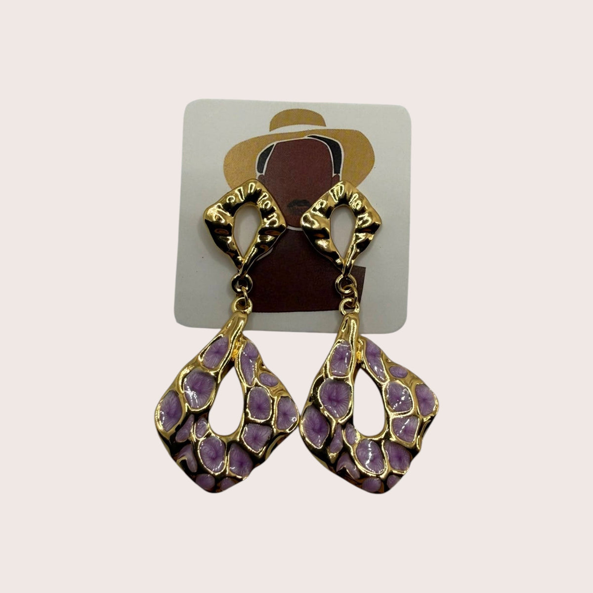 Nitelief gold-toned dangle earrings with pink and purple abstract spot enamel patterns in a diamond-shaped design.