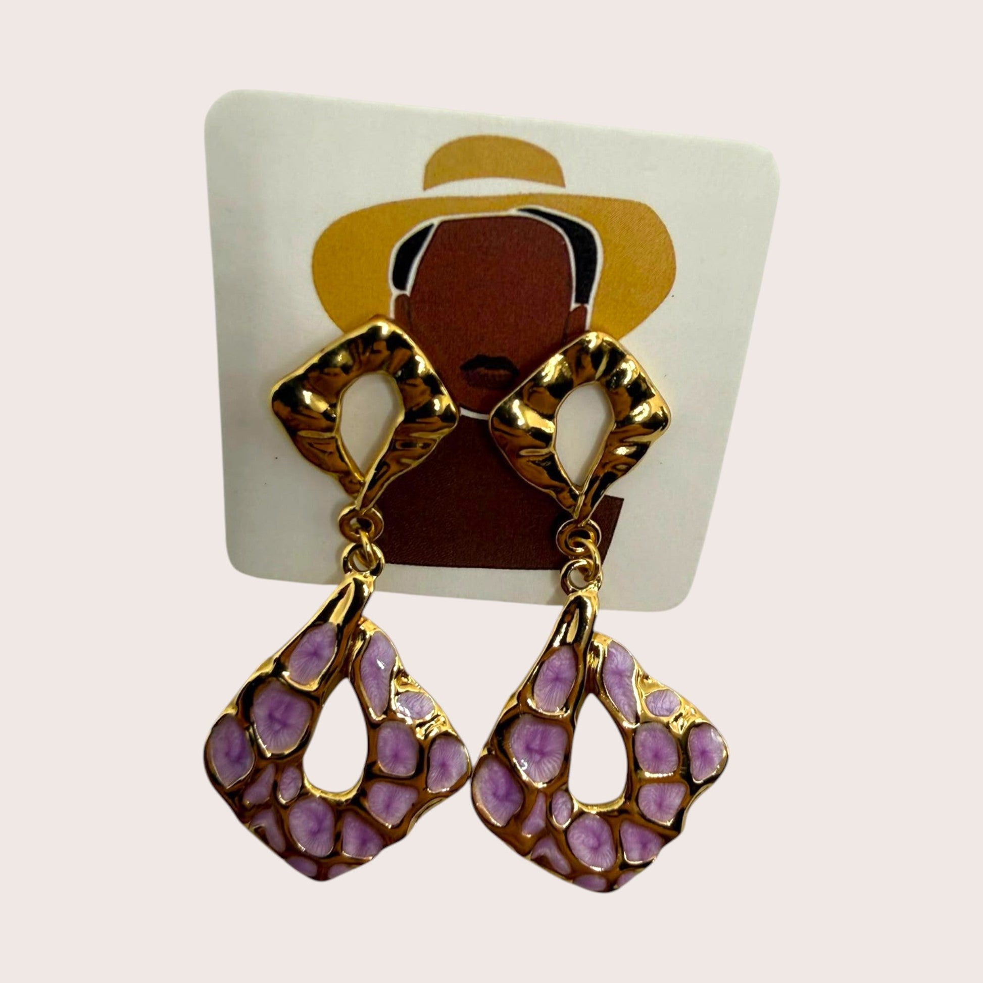 Nitelief gold-toned drop earrings featuring a unique pink and purple spotted enamel pattern in a geometric shape.