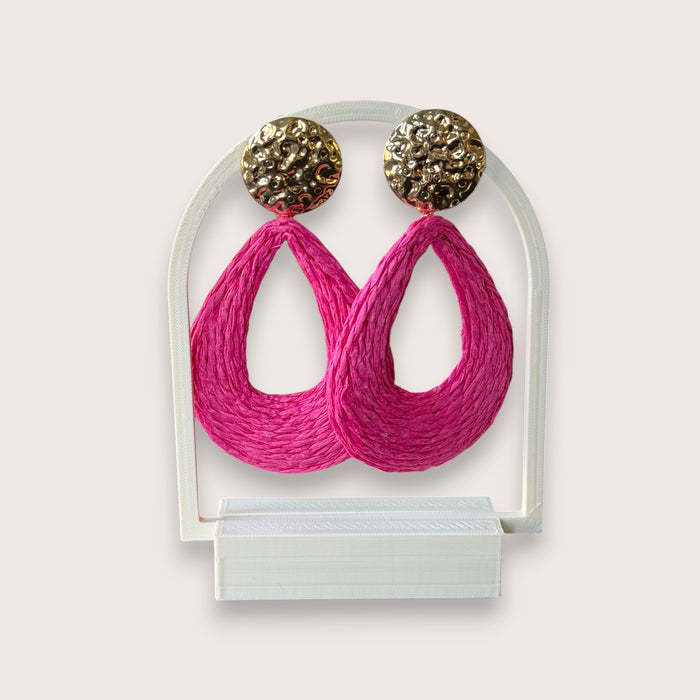 Nitelief pink raffia teardrop earrings with textured gold-tone studs in a bohemian woven style