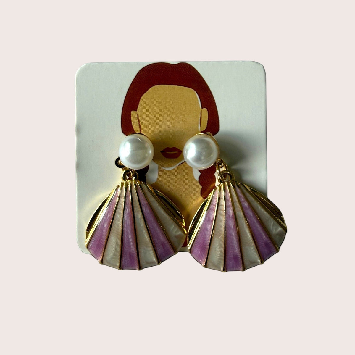 Nitelief shell earrings in light and dark pink enamel with pearl accents, crafted from gold-tone stainless steel.